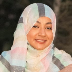 Sukaina Hussain, a woman wearing a pastel headscarf.