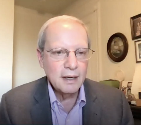 Older white man in suit and glasses