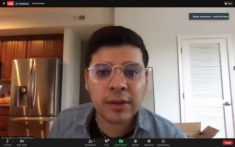 Young Hispanic man with glasses at home in virtual meeting