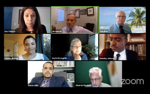 Eight people on Zoom screen in virtual meeting