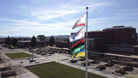 Flagpole at Richmond Civic Center with the California, city of Richmond, Pan-African and Ukrainian flags