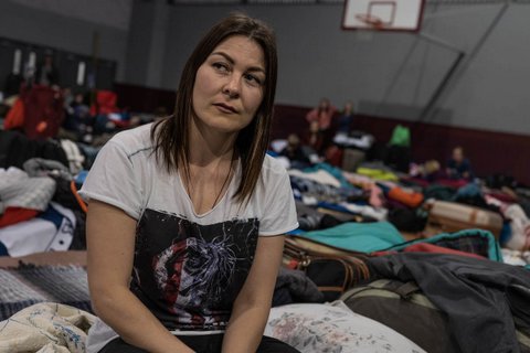 Woman in refugee shelter