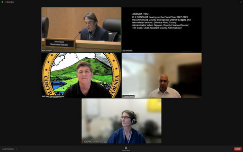 Screenshot from virtual meeting showing four people