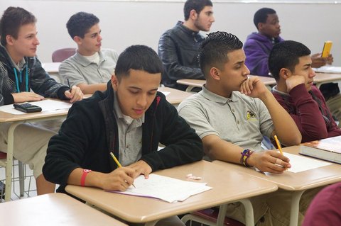 Two rows of male high school students of different races