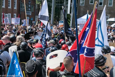 Crowd at Unite the Right rally with shields, signs and U.S. and Confederate flags
