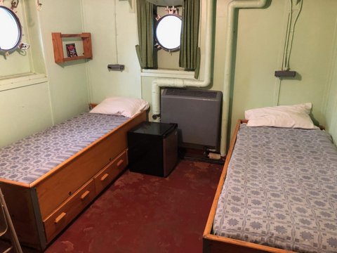 Living quarters on a ship with two small beds