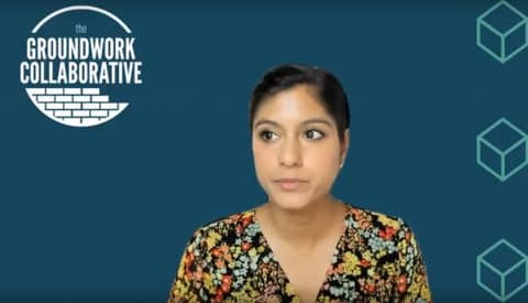 Screenshot of woman in front of blue background with logo that says "groundwork collaborative"