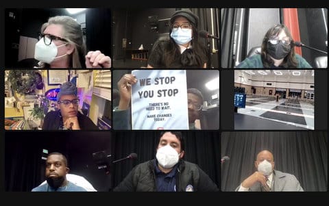 Eight people in virtual meeting. A Black man i holding a sign that says "We stop. You stop. There's no need to wait. Make changes today."