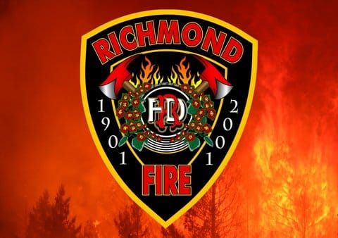 A forest fire overlaid with a shield that says Richmond Fire 1901 2001 and has images of two axes, flames and flowers