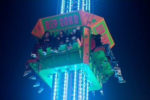 People on the Rip Cord, a carnival tower drop ride