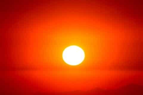 Sun against a red-orange sky