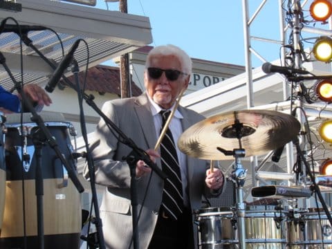 Pete Escovedo at his kit, drumsticks in hand