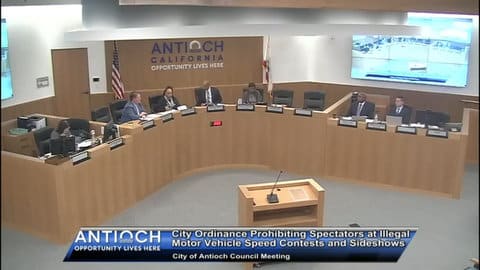 Screenshot from broadcast of Antioch City Council meeting with on screen text that says city ordinance prohibiting spectators at illegal motor vehicle contests and side shows